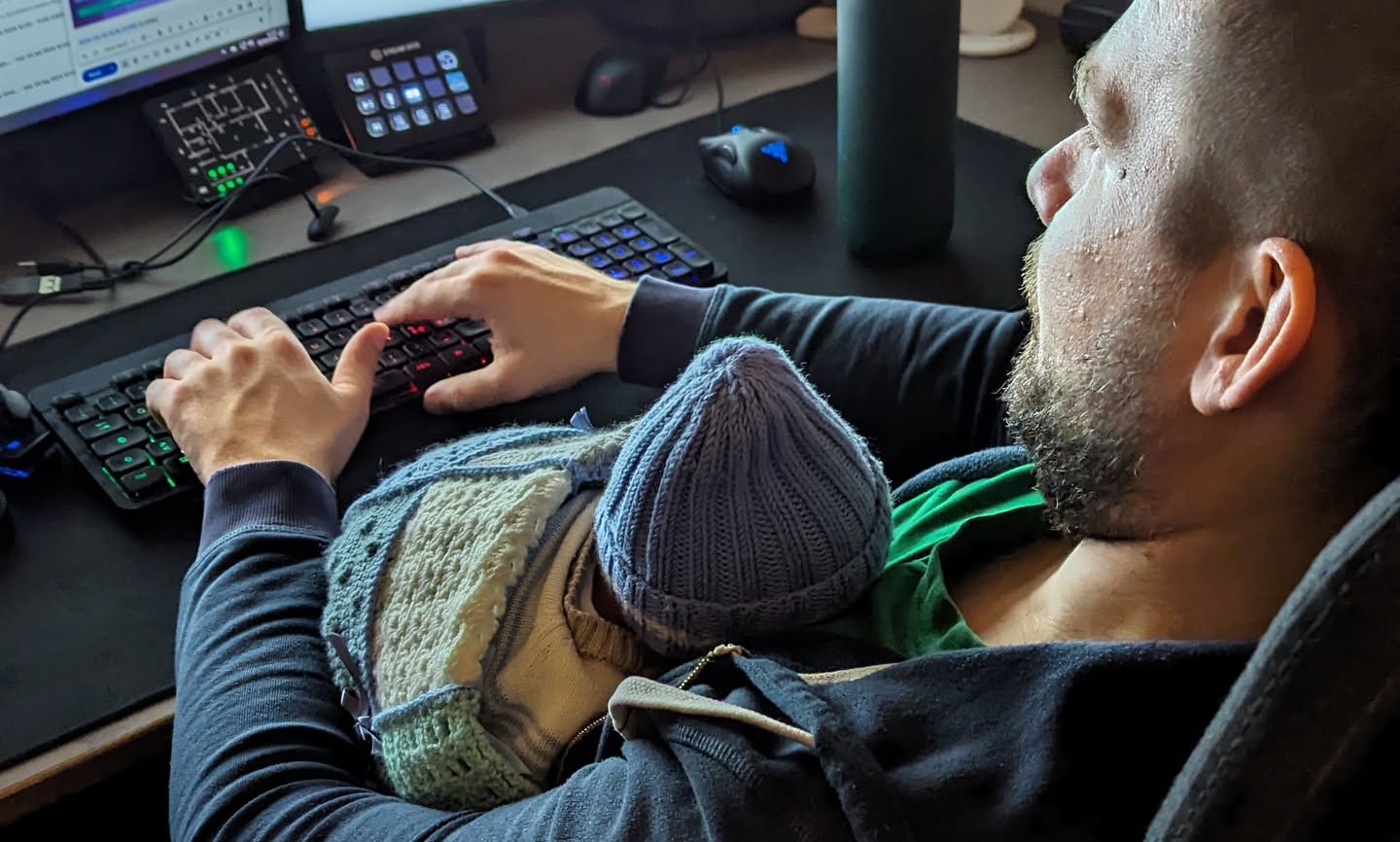 Trying to type on a regular keyboard with a baby sleeping on my chest — not ideal